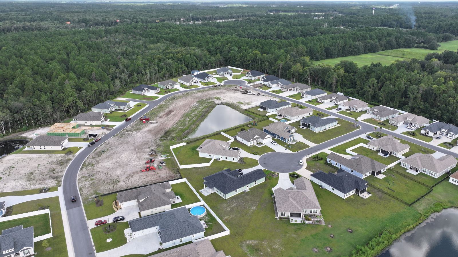 Wide aerial of the community and tree line