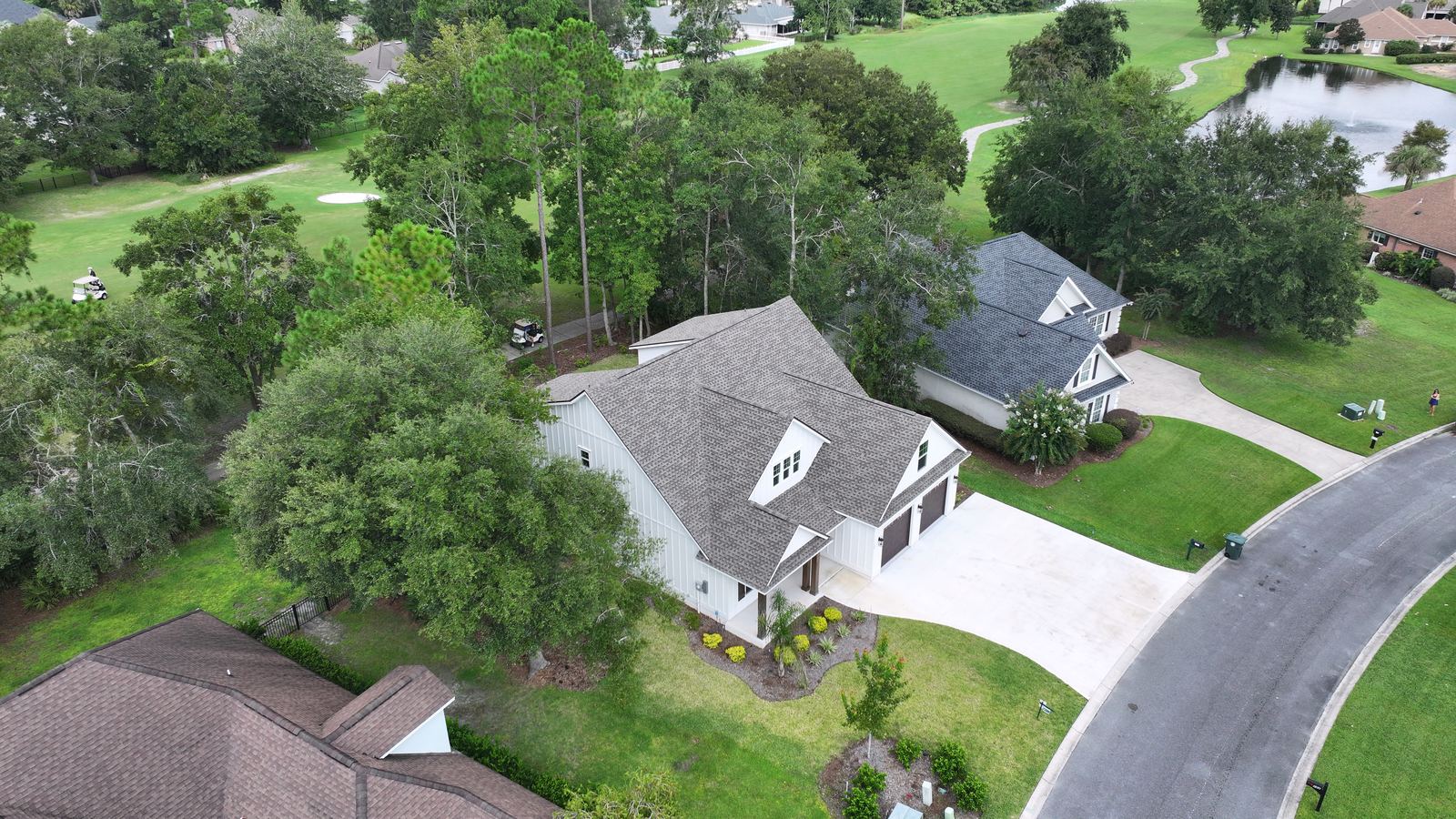 Aerial showing the home and the golf frontage