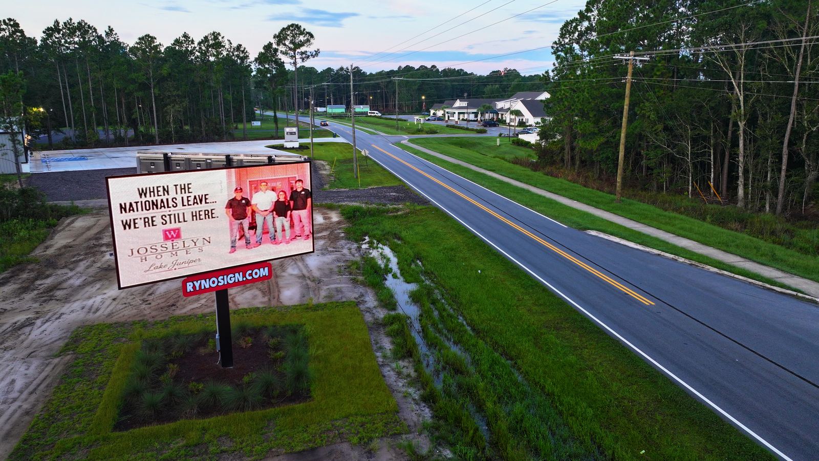 Billboard and highway approach in daylight